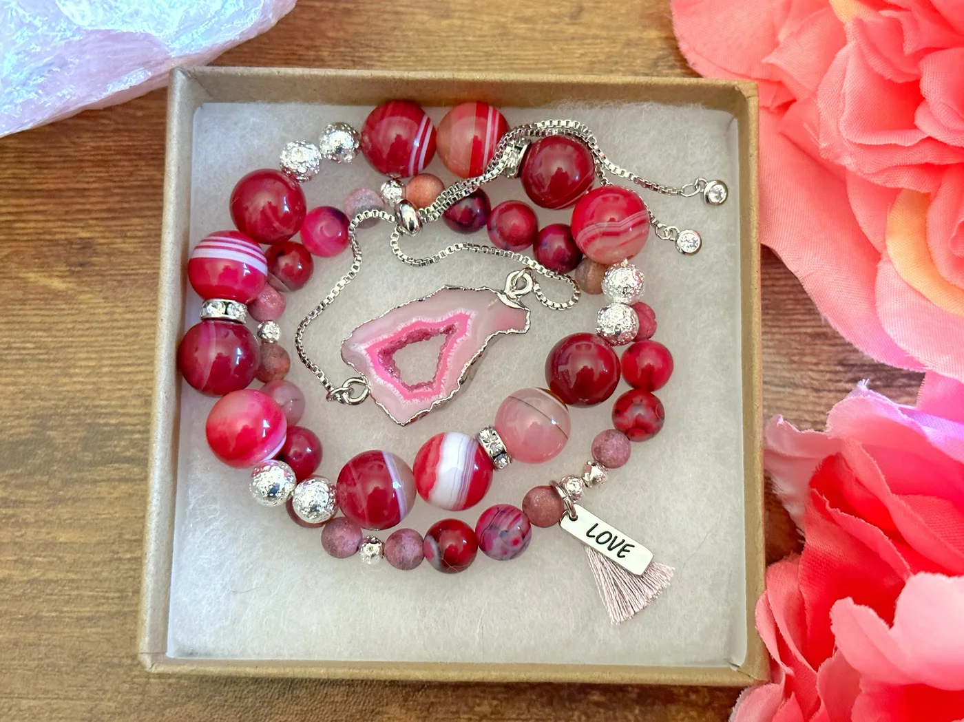 Pink agate bracelet stack with a central agate slice pendant