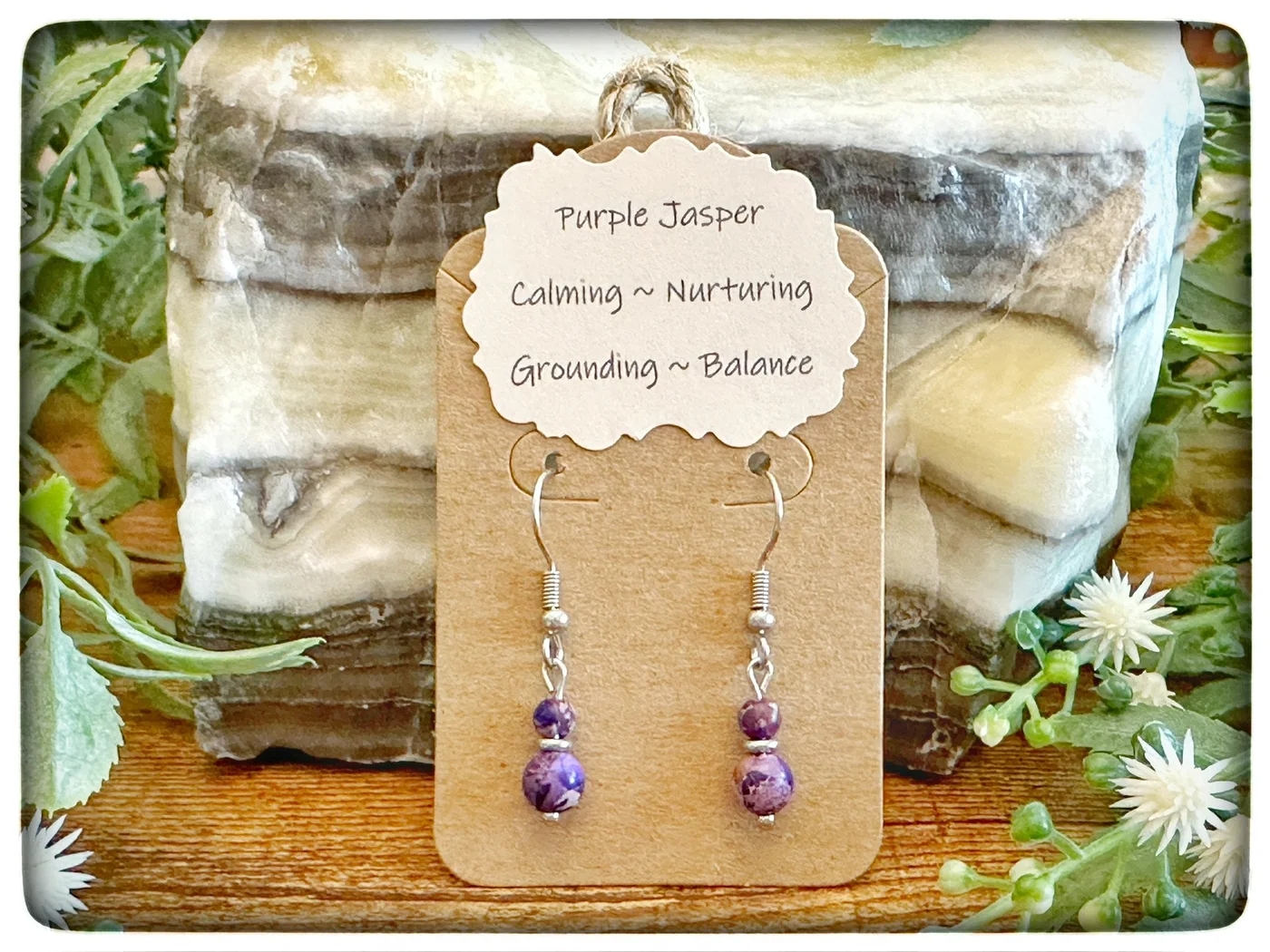 Purple jasper earrings on a kraft-paper display card